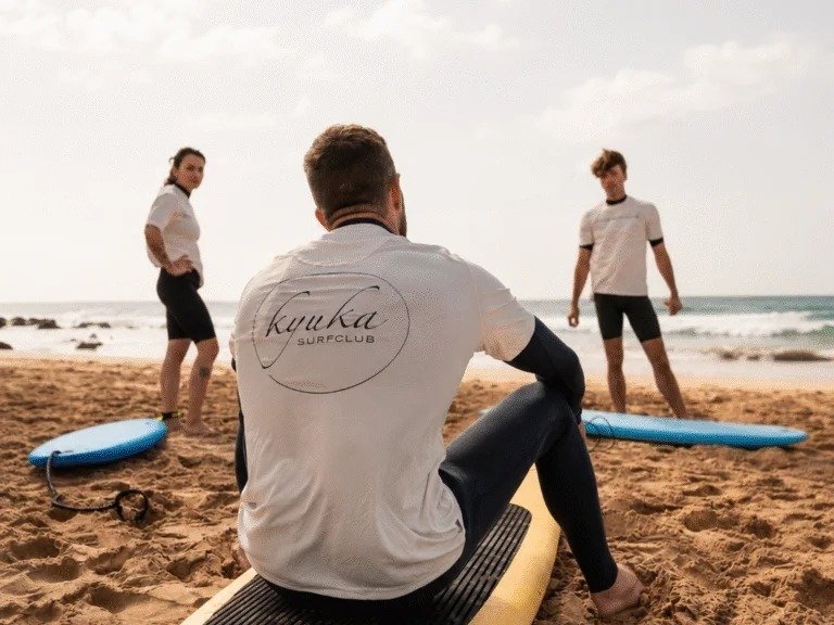 people in a surf class